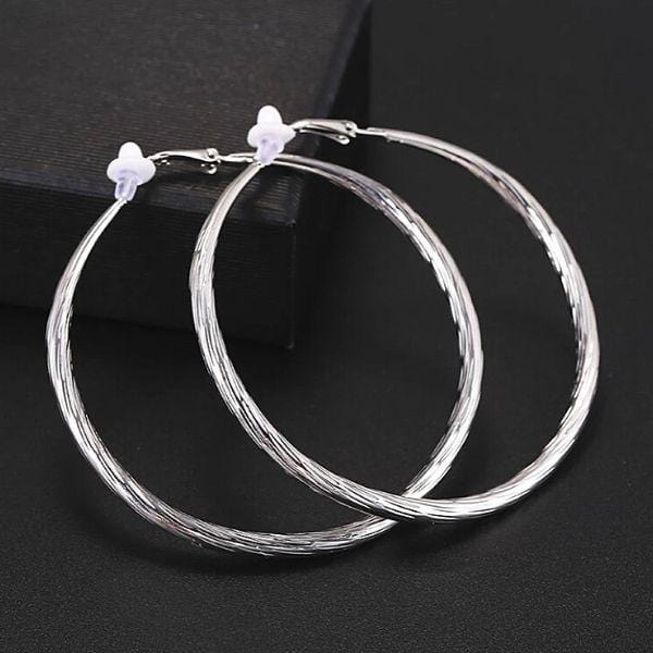 Lavishly Large Twist Silver Hoop Clip On Earrings - Ella Moore